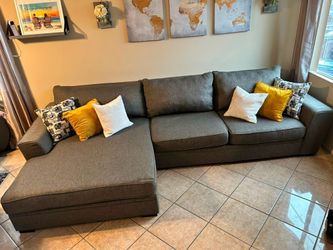 High Quality Sectional couch with extra wide chaise and large ottoman. DELIVERY AVAILABLE .