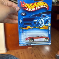 2001 Hot Wheels Austin Healey (Collector No. 167) in red and white.