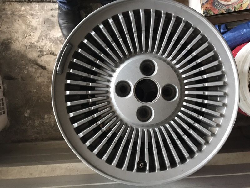 One Original Delorean wheel with a new and stock Goodyear tire mounted