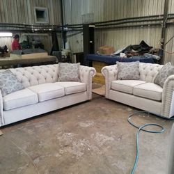 New tufted sofa and loveseat silver nail head in front of the arms