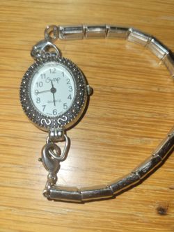 Vintage Swap Quartz Silver-Tone Oval Watch with Ornate Bezel