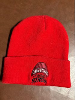 This red beanie features a "Cheech's Stash" beanie.embroidered logo