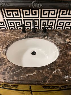 Bathroom vanity with sink and faucet