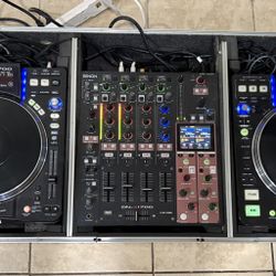 DJ setup consisting of two Denon DN-S3700 digital turntables and a Denon DN-X1700 mixer, all housed in a road case, and stand.