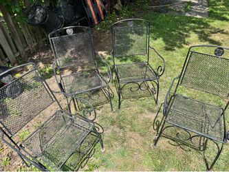 4 WROUGHT IRON PATIO CHAIRS $50