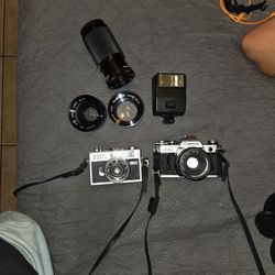 Canon  AE-1. Is The One On The https://offerup.com/redirect/?o=UmlnaHQucmljb2g= 500 G On The Left Plus Some Lenses 