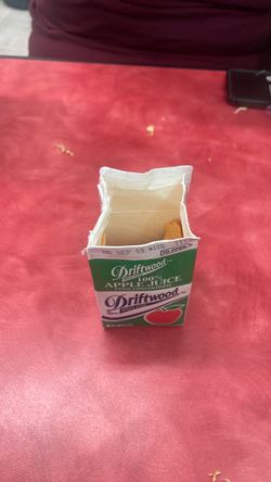 Apple juice box withe orange peels