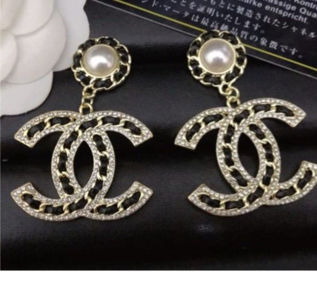 CC SILVER AND BLACK FAUX LEATHER EARRINGS