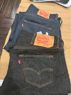 Levi’s 501s blue and black pair size 36x32 and 38x32