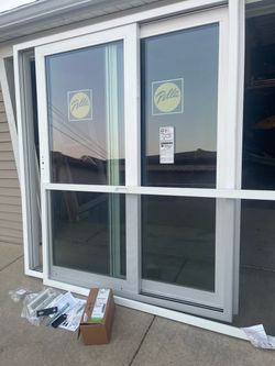 New patio  door Pella 250 model with argon size w71.1/2 h79.1/2.  Jam is 6 inch new construction screen lock to $875