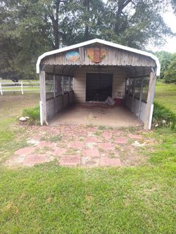 MAKE OFFER!!!      NEED GONE ASAP!!!!!Carport with storage in the back with roll up door screened in