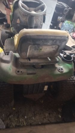 John Deere riding mower needs a battery and a carp clean as is for 200