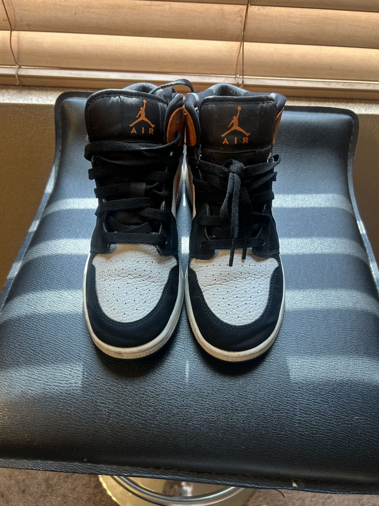 Black, Orange, And White Nike/Jordan’s