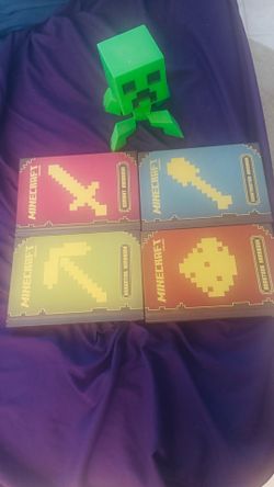 Minecraft handbooks and Creeper figurine