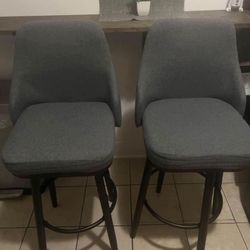 2 Grey Swivel Barstools $100