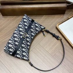 Fabric and cowhide handbag