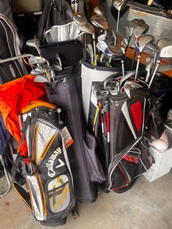 Lot of Golf Clubs and Bags
