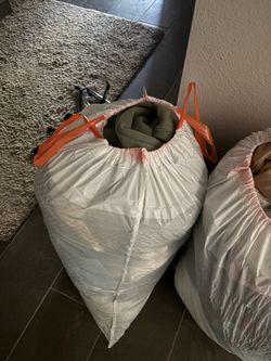 Large trash bag of men’s shirts