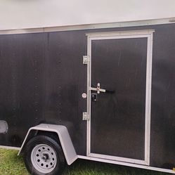 15 ft Lark enclosed trailer $2,000