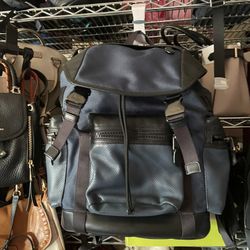 mochillas de hombre grandes y pequeñas Mk y coach