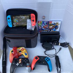 Nintendo switch console w/ 2 joycons, 4 controllers, travel case, and dock for tv w/ cords.  4 games: super Mario 3D all stars,Mario tennis aces,and +