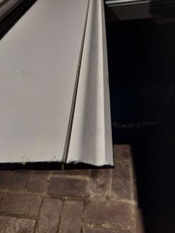 6 Peices Of 7.25 Inch X 8 Ft. Primed Wood Baseboard Molding.
