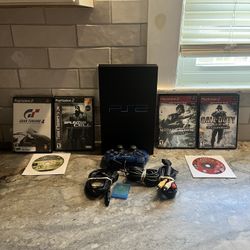 Pristine condition PS2 with Classic PS2 games, aswell as all the wires. Controller and memory card included