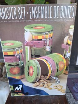 New in box 4 piece ceramic canister set