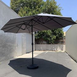 (Brand New) $130 Large Double Sided Outdoor (15ft Umbrella and 65lbs Plastic Base set) Colors Red/Gray