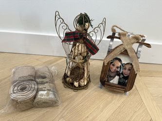 A Bucket Full Of Christmas Ornaments And Decorations 