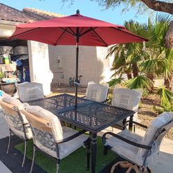 Patio Set All New Table And 6 Chairs With New Cushions And New Umbrela 