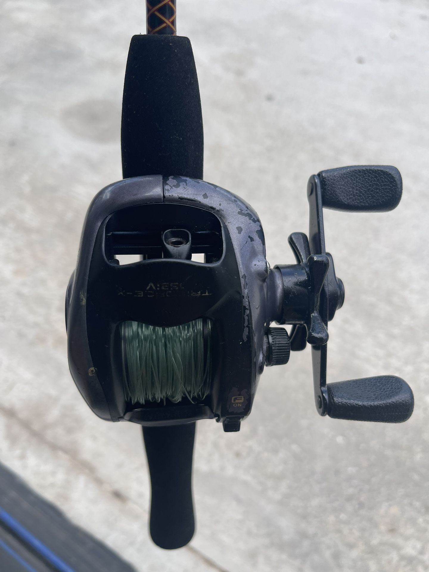 Daiwa Infinite Bait caster on 5’ Shakespeare Ugly Stik #7