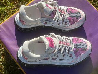 Versace Trigreca sneakers, featuring a bold pink and white colorway with the signature Greek key pattern along the chunky sole