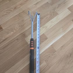  New Fiskars brand hand rake or scratch tool designed for loosening soil and weeding. 