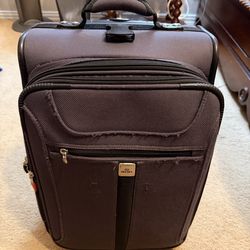 SUITCASE  15"w x 9"deep x 21 1/4"tall; cross streets are Arapaho & Waterview