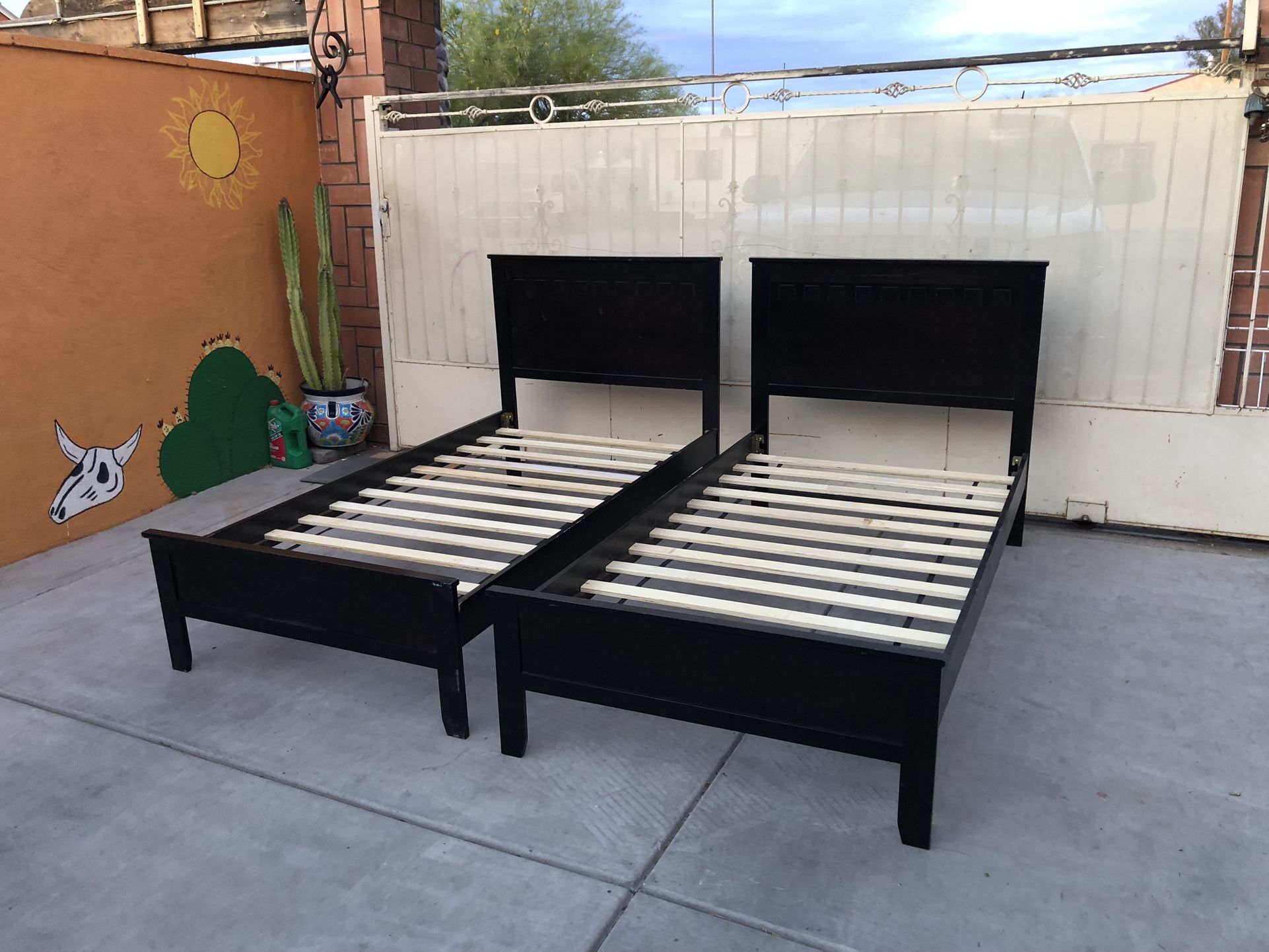 Two black twin beds frames $120 for both 