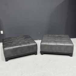 2 Grey Leather Ottomans