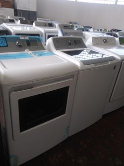 NEW scratch and dent GE top load washer and dryer set