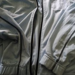 This is a light blue zip-up hoodie.