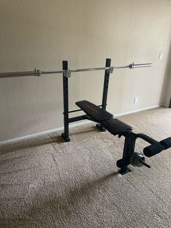 Bench with bar and sit-up bench