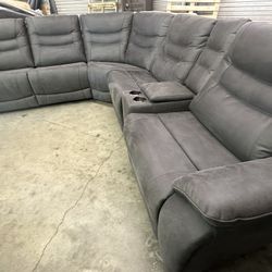 Kelsee Fabric Power Reclining Sectional with Power Headrests  Retails for over $2,550 Set is new. Small scrapes from delivery (see last two pics) All 