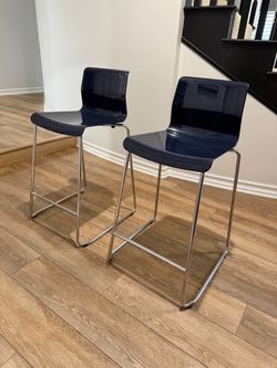 Two blue ikea bar stools