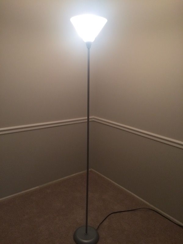 Floor lamp. Silver color base and post. Good condition. Just under 6 feet.