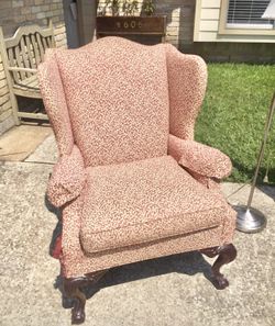 Leopard print wingback chair with claw feet