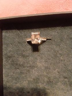 Emrarld cut mossiate engagement ring