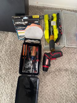 Assortment of sockets , and random wrenches