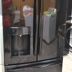 Semi New GE French Refrigerator. Works Good And Is In Mint Condition