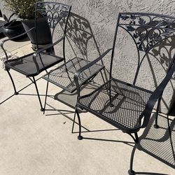 2 wrought iron chairs with table no cushions needed