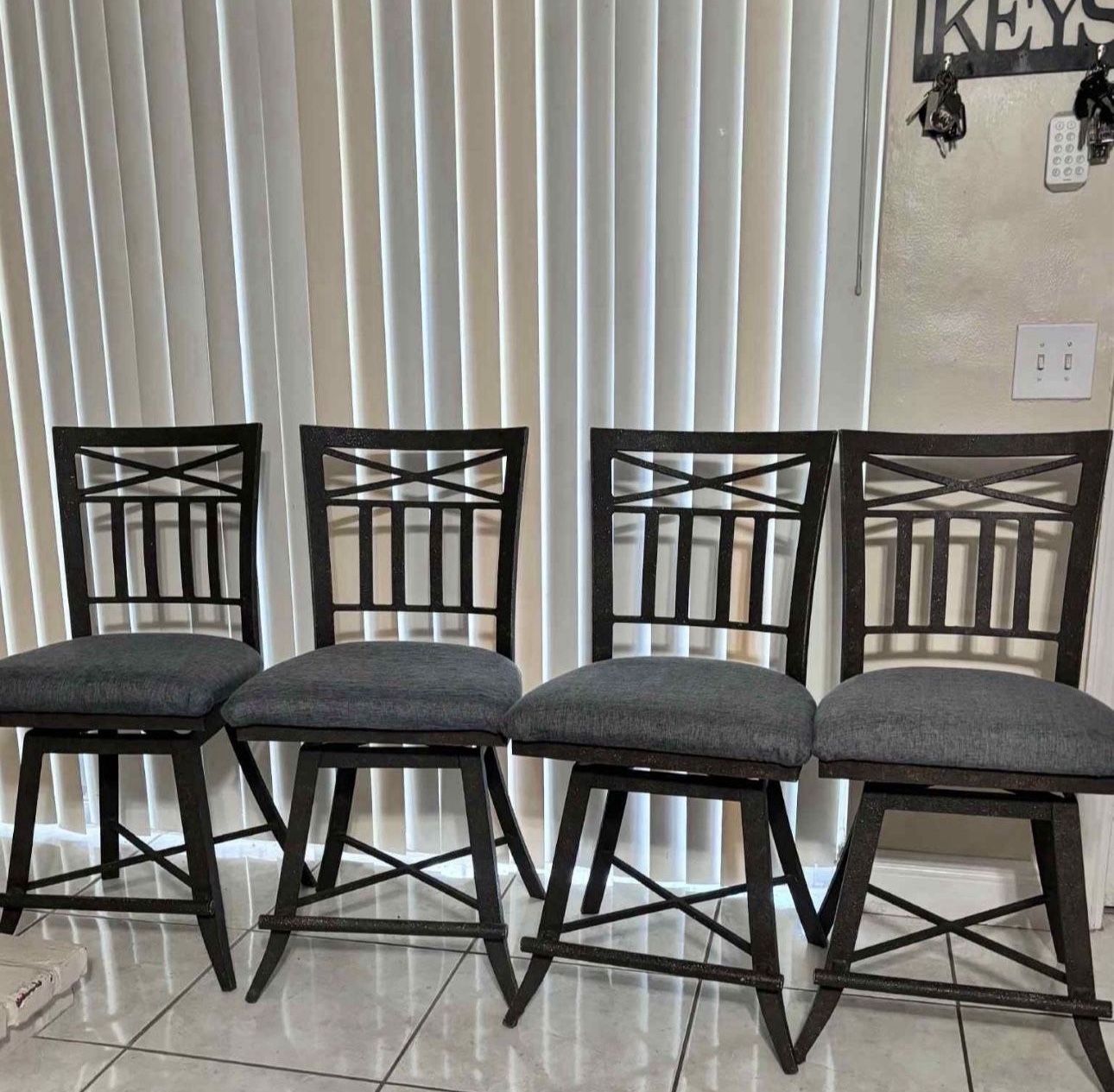 4 Wrought-Iron Swivel Bar Stools