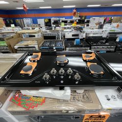 BLACK GE BUILT IN GAS STOVE